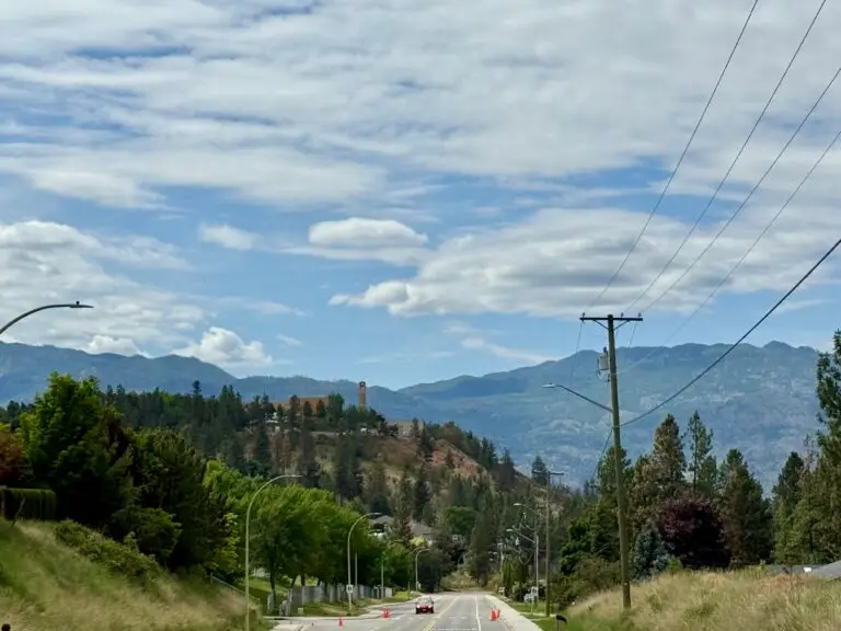 A home in the foreground financed through The HomeHappy Team @ Canadian Mortgage Experts. West Kelowna's Mortgage broker